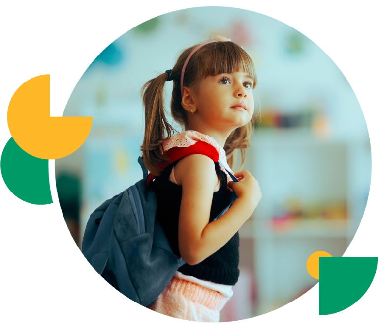 Girl with backpack looking upward in classroom.