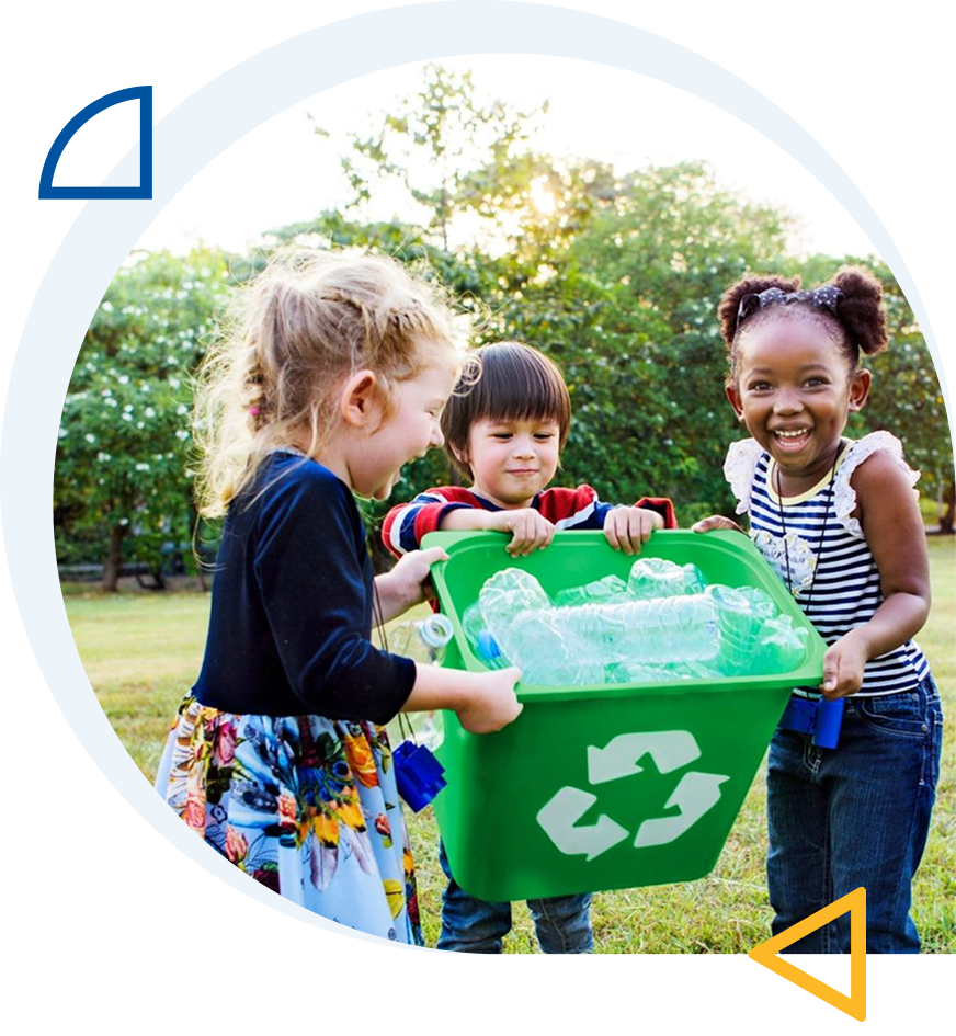 Children recycling plastic bottles outdoors together.